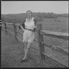 Unidentified woman and fence