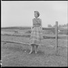 Unidentified woman and fence