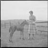 Unidentified woman with colt