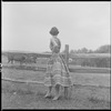Unidentified woman and fence