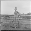 Unidentified woman and fence