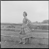 Unidentified woman and fence