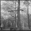 Outdoor sign reading "Woodland Farm, A.L. Haskell"