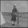 Unidentified woman and fence