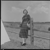 Unidentified woman and fence