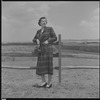 Unidentified woman and fence