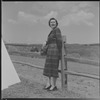 Unidentified woman and fence