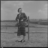 Unidentified woman and fence