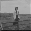 Unidentified woman on fence