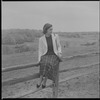 Unidentified woman on fence
