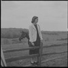 Unidentified woman on fence