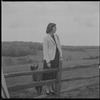Unidentified woman on fence