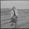 Unidentified woman on fence
