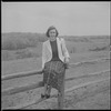 Unidentified woman on fence
