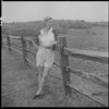 Unidentified woman and fence