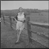 Unidentified woman and fence