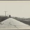 View of road leading from Montauk Railroad Station around Fort Pond to the Hither Plain. Looking west towards Railroad Station. Montauk, East Hampton