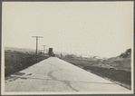 View of road leading from Montauk Railroad Station around Fort Pond to the Hither Plain. Looking west towards Railroad Station. Montauk, East Hampton