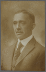 Studio portrait of Paul D. Blackwell in pinstriped suit