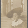 Woman in wide hat and lace collar