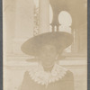 Woman in wide hat and lace collar