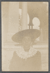 Woman in wide hat and lace collar