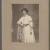 Studio portrait of Sarah Myers Blackwell standing behind chair