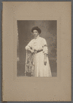 Studio portrait of Sarah Myers Blackwell standing behind chair