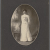 Studio portrait of Sarah Myers Blackwell standing next to table