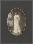 Studio portrait of Sarah Myers Blackwell standing next to table