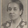 Studio portrait of Sarah Myers Blackwell in pearls and floral dress