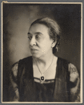 Studio portrait of Sarah Myers Blackwell in pendant and lace dress