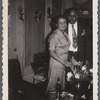 Jean and John standing next to flowers