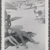 Woman lying on back at beach