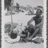 Man sitting next to woman at beach