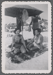 Jean Blackwell Hutson with woman on beach blanket