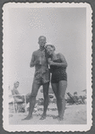 Man and woman standing on beach