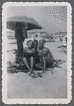 Jean Hutson and others on beach blanket