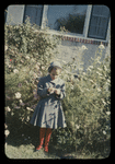 Jeanie standing in front of bushes