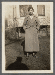 Woman in beret and long coat