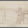 Woman standing on boardwalk