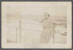 Woman standing on boardwalk