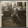 Seventeen-year-old Jean Blackwell Hutson on lawn in hat and scarf