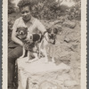 Jean Blackwell Hutson outdoors with two dogs