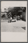Jean Blackwell Hutson on bench reading