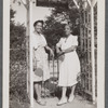 Two women under trellis