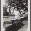 Woman at table tennis table