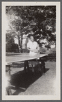 Woman at table tennis table