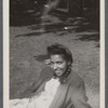 Woman in braids and cardigan