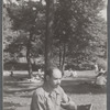 Man with camera in park